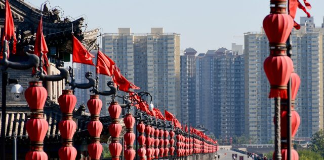 people walking on street near high rise buildings during daytime